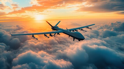 photo of unmanned military drone flying over clouds during sunset