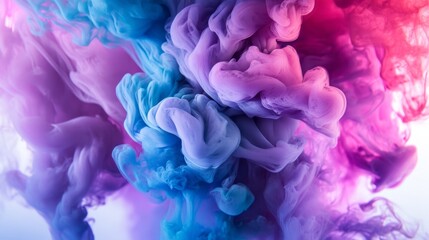 Fototapeta premium A dreamy underwater scene of ink swirling in water, featuring vibrant purple, blue, and pink hues, displayed on a white background with space for captions.