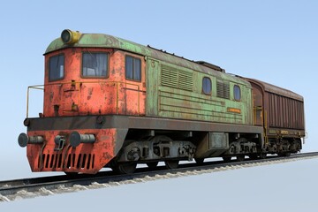 Rusty vintage locomotive on a sunny day by the railway tracks