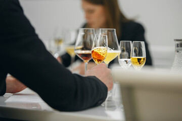 Blind tasting, close up. Wine waiter training school. 