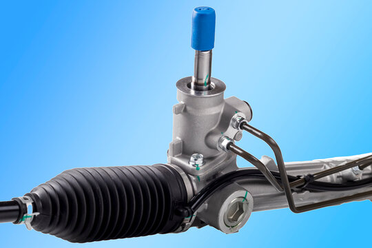 Studio lighting. on a white background, the steering rack of the car. New part.