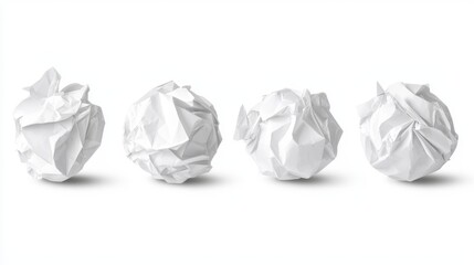 Obraz premium Set of four crumpled white paper balls, isolated on white background, detailed texture and wrinkles, perfect for waste management, stress, or creativity concepts
