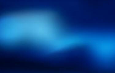 Obraz premium A blurred gradient background fades from light blue to dark blue.