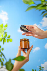 A stock photo suitable for beauty product advertisements showcases a mockup of a brown jar being...