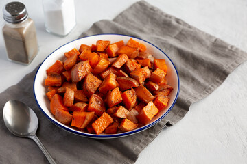 Homemade Roasted Sweet Potatoes on a Plate, side view.