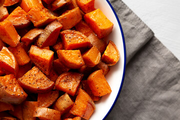 Homemade Roasted Sweet Potatoes on a Plate, top view. Overhead, from above. Copy space.
