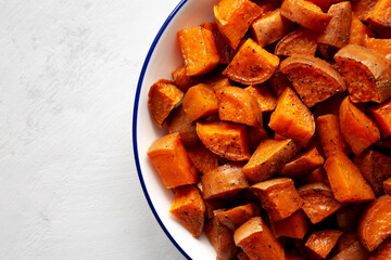Homemade Roasted Sweet Potatoes on a Plate, top view. Overhead, from above. Copy space.