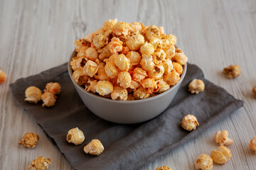 Homemade Crunchy Chicago-Style Popcorn with Caramel and Cheese in a Bowl, side view.