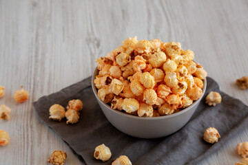 Homemade Crunchy Chicago-Style Popcorn with Caramel and Cheese in a Bowl, side view.