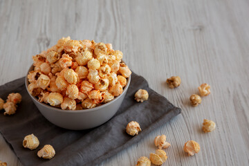Homemade Crunchy Chicago-Style Popcorn with Caramel and Cheese in a Bowl, side view. Copy space.