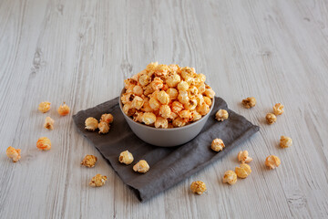 Homemade Crunchy Chicago-Style Popcorn with Caramel and Cheese in a Bowl, side view.