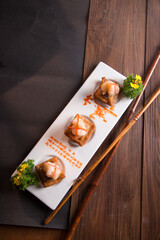 chinese banquet stir fried big tiger prawn with tofu beancurd cocktail butler canape in plate on wood table asian restaurant cafe fine dining halal menu