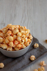 Homemade Crunchy Chicago-Style Popcorn with Caramel and Cheese in a Bowl, side view.