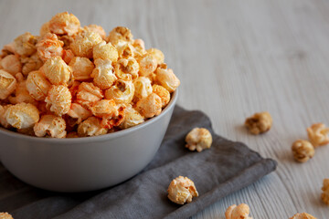 Homemade Crunchy Chicago-Style Popcorn with Caramel and Cheese in a Bowl, side view.