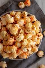 Homemade Crunchy Chicago-Style Popcorn with Caramel and Cheese in a Bowl, top view. Close-up.