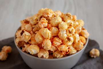 Homemade Crunchy Chicago-Style Popcorn with Caramel and Cheese in a Bowl, side view.