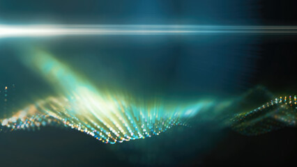 A green, glowing particle wave forms a dynamic curve, suggesting energy, sound, or data visualization on a dark background