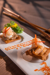 chinese banquet stir fried big tiger prawn with tofu beancurd cocktail butler canape in plate on wood table asian restaurant cafe fine dining halal menu