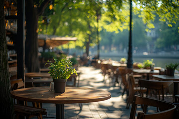 Summer outdoor cafe. Empty table in a cafe on the embankment in French style.