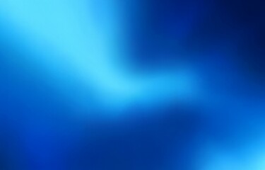 Obraz premium A blurred gradient background transitions from a lighter blue to a darker blue.