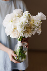 Beautiful bridal bouquet of white flowers Freesia, Eucalyptus, Rose, Eustoma