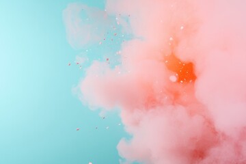 Naklejka premium Expansive cloud of pink and orange smoke against blue backdrop