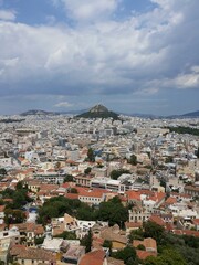 View of Athens from a height. Panoramic view of the city of Athens, Greece, from a height, under a cloudy sky. 
