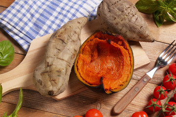 Fruits of the Earth. Sweet potatoes and a slice of pumpkin cooked in the oven and photographed from above.