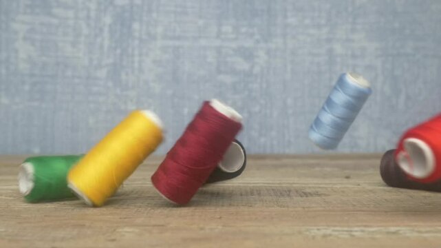 Vibrant and Colorful Spools of Thread in Graceful Motion, Capturing the Essence of Creativity