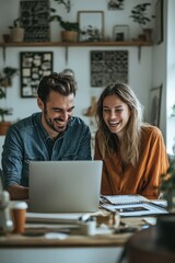 Young man and woman collaborating in a modern office setting with a laptop, showcasing teamwork and productivity