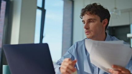 Entrepreneur rejoicing success reviewing documents at desk with laptop closeup. 