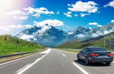 Fototapeta premium The car is driving along the highway surrounded by picturesque nature.