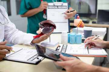 Businessman shaking hands with doctor in conference room Doctor and pharmacist shaking hands in medical office Salesman with new medicines shaking hands in hospital with medical team