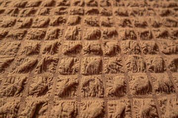 abstract background of an old brown cotton voluminous fabric close up perspective view shallow depth of field
