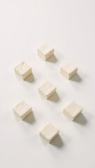 Obraz premium White-background photograph featuring isolated tofu cubes