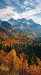 Obraz premium Breathtaking autumn landscape with vibrant foliage, majestic mountains, and a dramatic skyline under a clear blue sky.