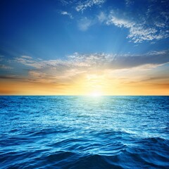 Fototapeta premium summer sea background bright blue water and setting sun