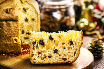 candied fruit panettone, slice of traditional baked Christmas cake for Christmas and New Year.