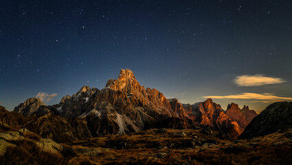 Cimon delle Pala mountain above Passo Rolle with clouds at night with stars © Jaro