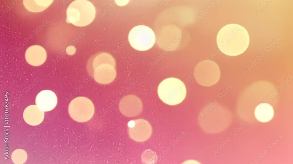 Poster golden particles are gently moving over a pink gradient background. this animated background is perf