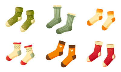 Set of stylish cotton and wool socks with different texture, color, pattern and type. Two pairs of identical socks on a white background. Warm wool socks with cute patterns. Autumn and winter socks.