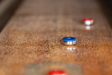 Playing a game of shuffleboard.