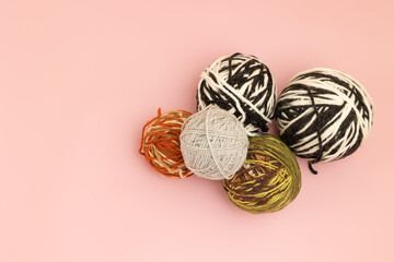 Balls of knitting thread on a table