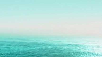 Obraz premium A tranquil moment at dawn with a stunning blue to green gradient over a serene ocean background