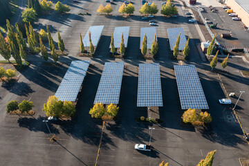 Aerial Drone photo of an environment-friendly huge roof solar panels, using clean renewable solar energy, installed on a roof of parking lot covers