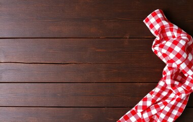 Obraz premium Red Checkered Tablecloth on a Wooden Surface