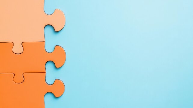 Colorful puzzle pieces on a blue background, symbolizing problem-solving and creativity in education or teamwork concepts.