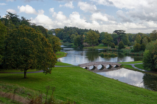 The Five Arch Palladian Bridge over the serpentine lake at Painshill Park in Cobham Surrey UK