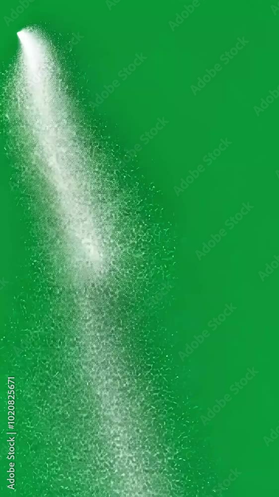 Poster white spray disperses against a green screen, creating dynamic shapes. fluid patterns and textures e