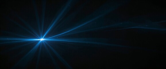 A blue light is shining on a black background. The light is bright and has a star shape
